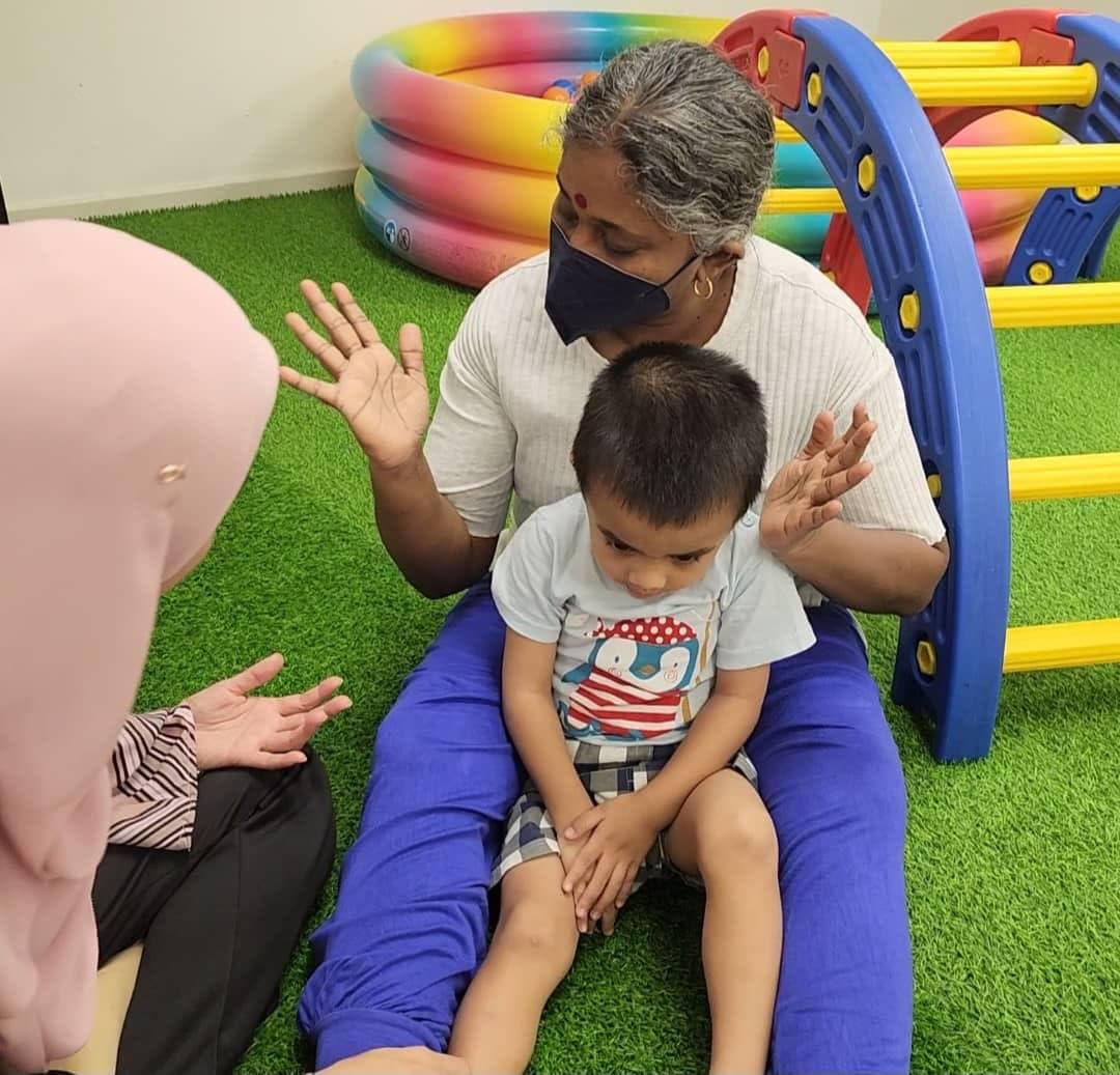 MHHO therapist supporting a young child during a sensory-friendly session